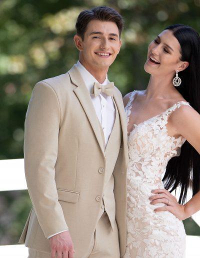Couple in formal attire with beige suit and white lace wedding dress - Tuxedo Rental, Men's Suits, Richardson Wedding