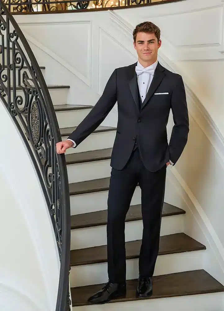 Tuxedos - Couture 1910 Black Wool Tuxedo Couture 1910 black wool tuxedo on a grand staircase - black-tie tuxedo rental in Richardson, TX